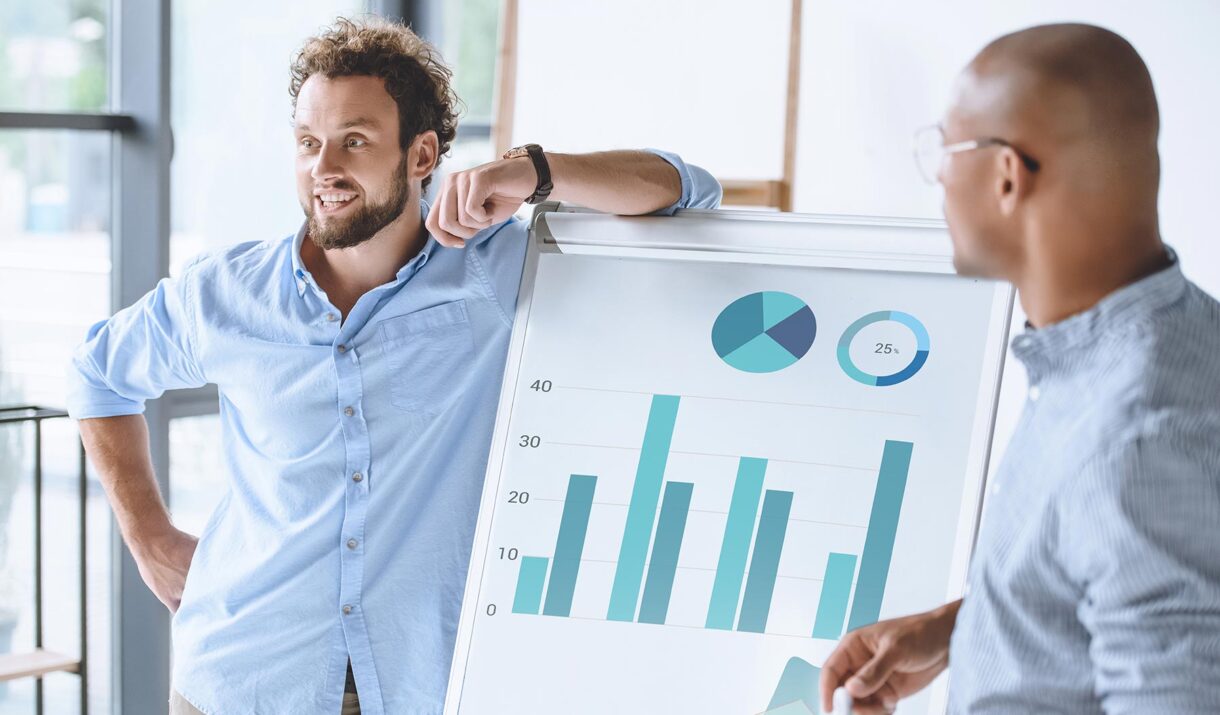 multiethnic businessmen standing near white board 74gv65m